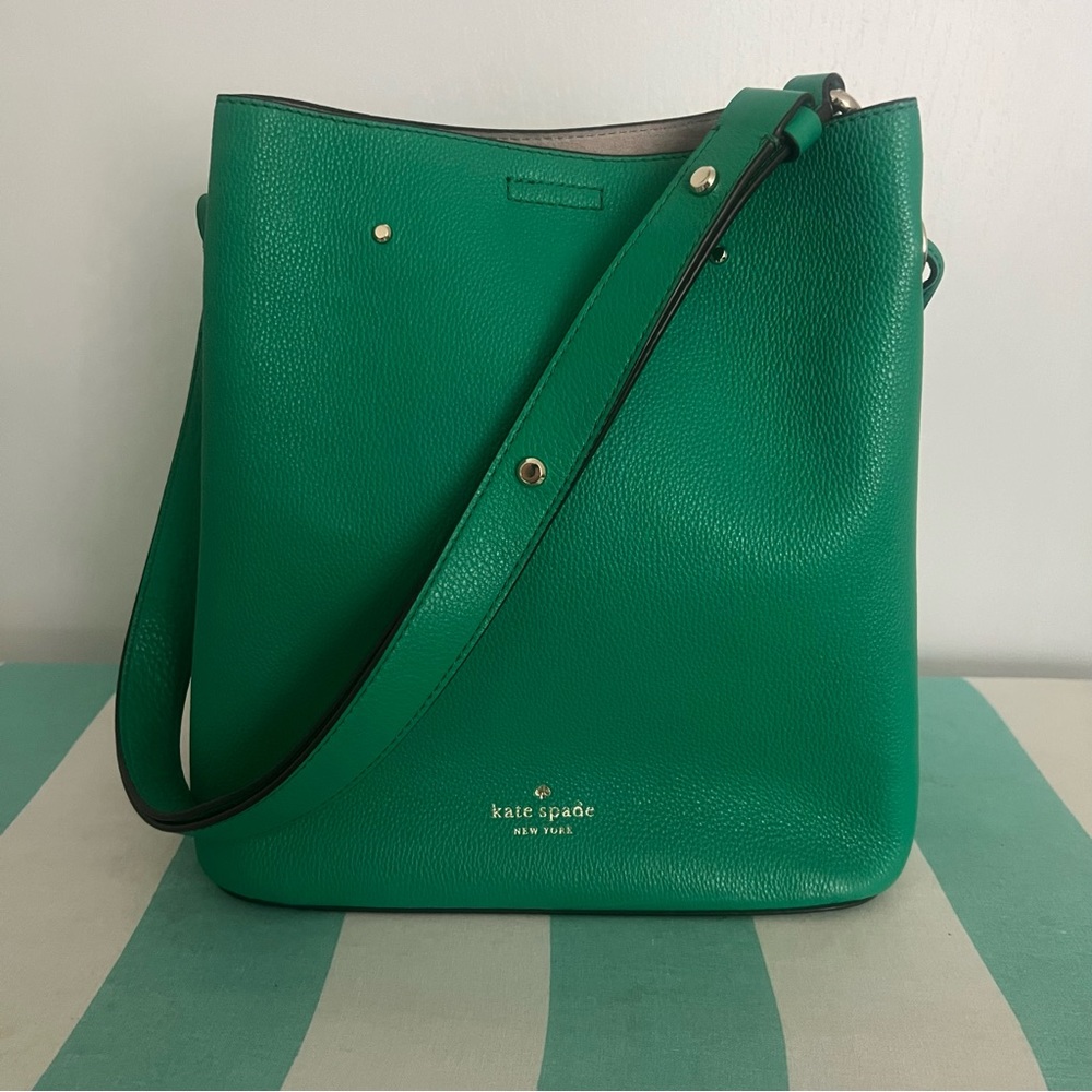 Green Kate Spade bucket bag.